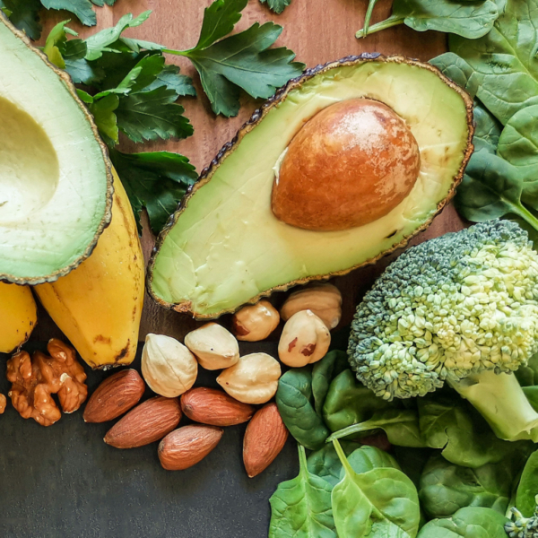 a colourful image of vegetables, fruit and nuts that are all high in magnesium