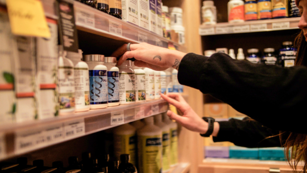 Brooke stocking the Wellness shelves