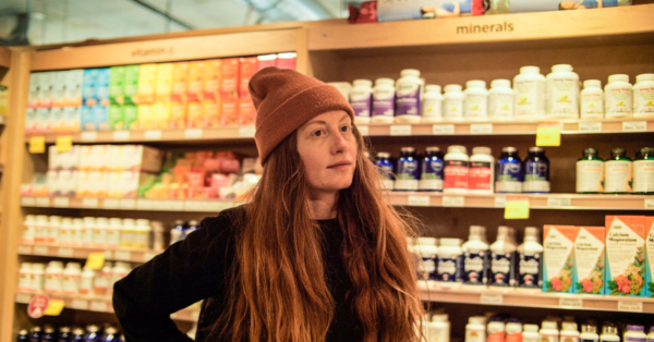 Brooke stocking shelves in the Wellness department