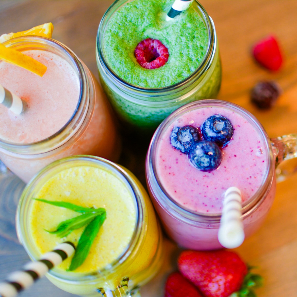 Beautiful image of several different colourful smoothies.