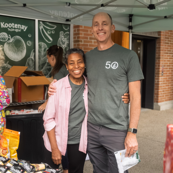 Kay and Paul handing out goodies on the Co-op's 50th Birthday.